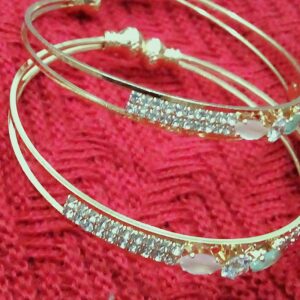 two intertwined golden bangles